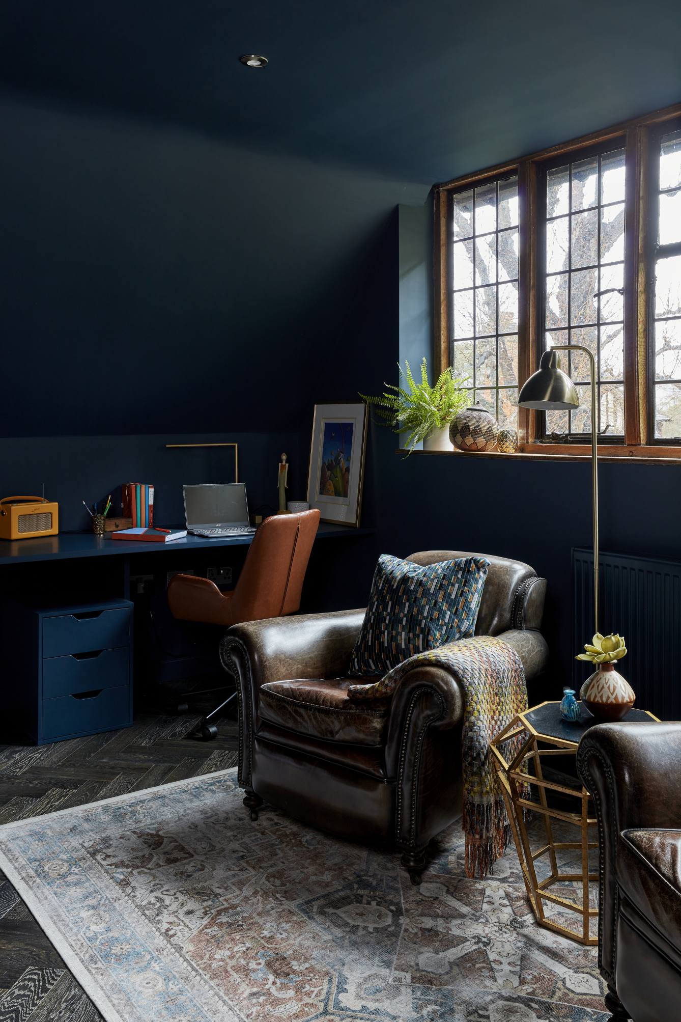 Study workspace with bespoke desk and leather chair in a Surrey manor house.